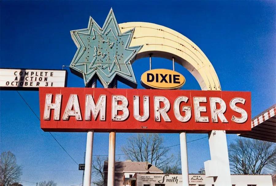 Colour photograph of a large roadside sign saying Dixie Hamburgers.